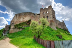 64042042 - beautiful old castle ruins on a green hill.
