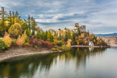 Beautiful castle by the lake at dusk in autumn